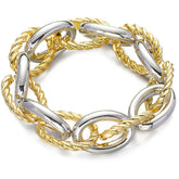 Elegant gold and silver bracelet with a twisted chain, showcasing an interlocked twine oval chain design.
